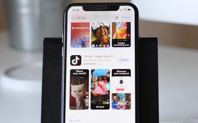 TikTok app being downloaded on a smartphone